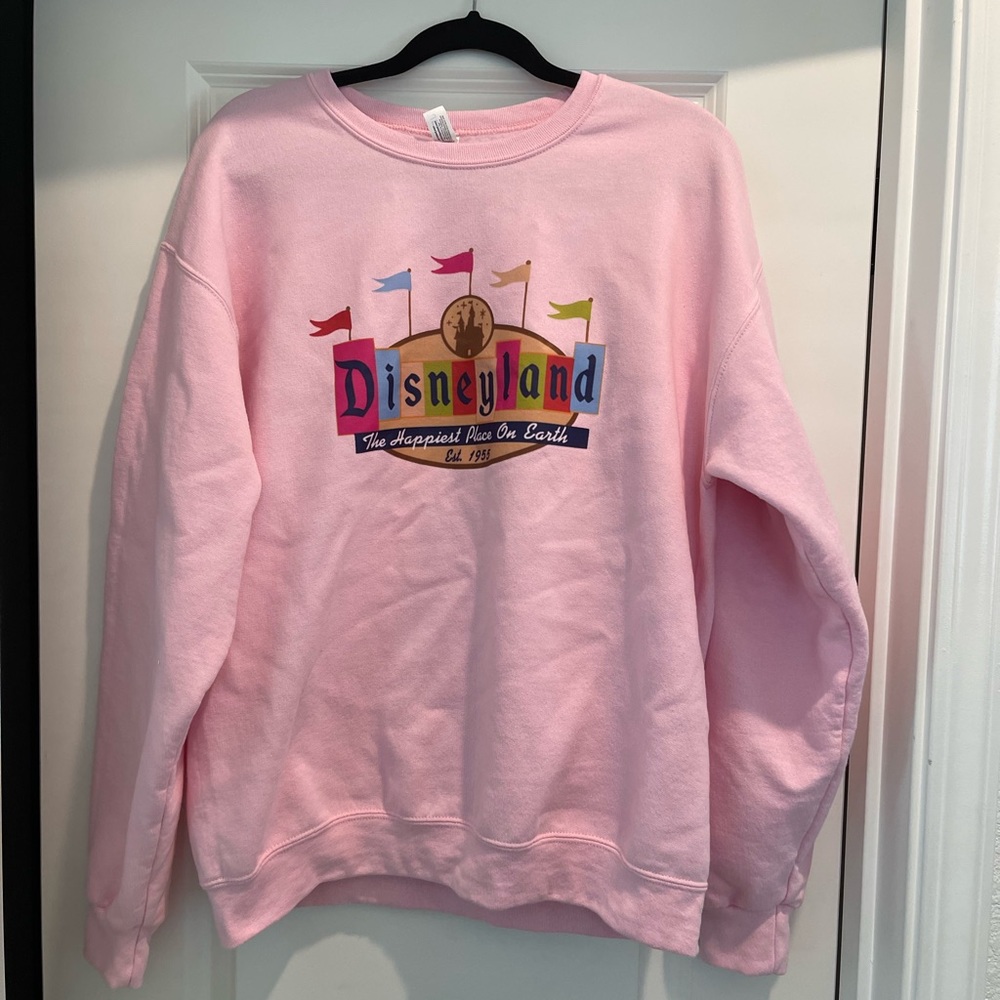 Women’s pink Disneyland sweatshirt size large